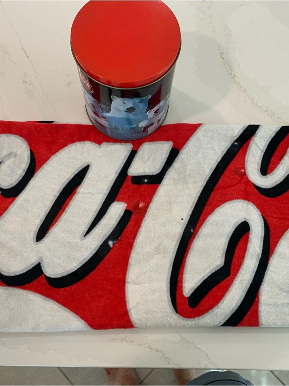 Coca Cola tin and towel, collectable